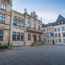 a large building with a flag in front of it