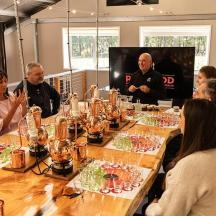 a group of people sitting around a long table