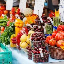a display of fruits and vegetables in baskets on a table