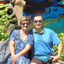 a man and a woman sitting on a bench