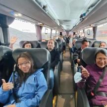 a group of people sitting on a bus