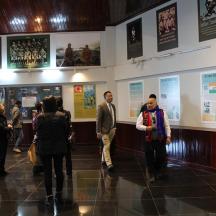 a group of people walking through a museum