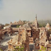 a large group of buildings with domes and roofs
