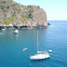 a boat in a body of water with other boats