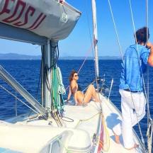 a man and woman on a boat in the water