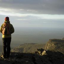 a man standing on the top of a mountain