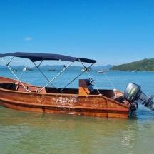 a wooden boat is sitting in the water