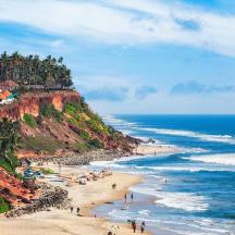 a beach with people on the sand and the ocean