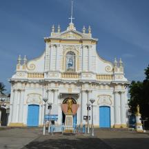 a large white building with a clock on it