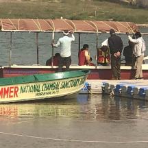a group of people on a boat on the water