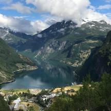 a view of a lake in a valley with mountains