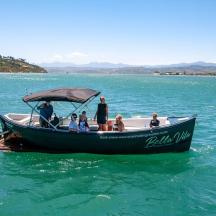 a group of people on a boat in the water