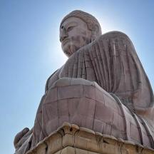a large statue sitting on top of a building
