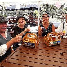 a group of people sitting at a table with drinks