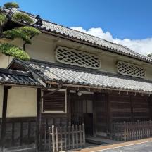 an asian building with a tree in front of it