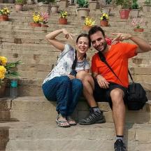a man and a woman sitting on some steps