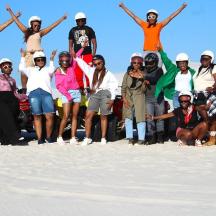 a group of people posing for a picture in the snow