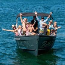 a group of people on a boat in the water