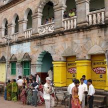 a group of people standing outside of a building
