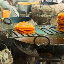 a grill with a stack of pancakes on it