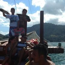 a group of people on a boat in the water