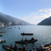 a group of people in boats on a lake