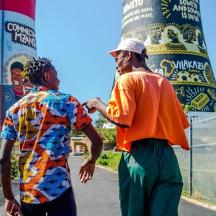 two men are walking down a street