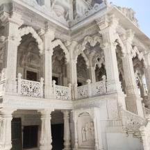 a large white building with a balcony