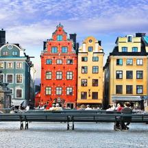 a bench in front of a group of buildings