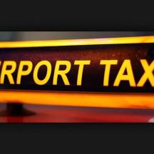 a yellow sign with the word airport taxi on it