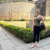 a woman standing in front of a castle
