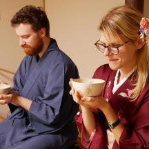 a man and a woman holding bowls in their hands