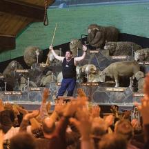 a man standing on a stage in front of a crowd