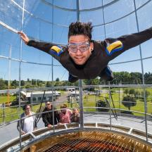 a man on a zip line in the sky