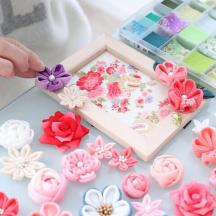 a child is making flowers out of cookies