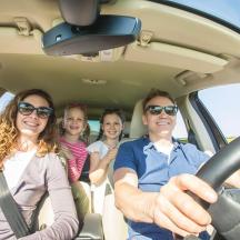 a group of people sitting in a car