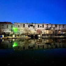 a body of water with a group of buildings