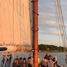 a group of people on a boat in the water