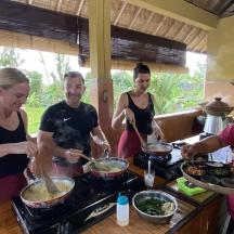 a group of people preparing food in a kitchen