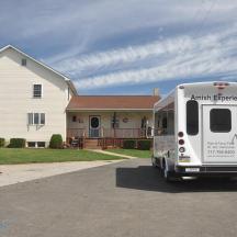 a white truck parked in front of a house