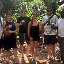 a group of people wearing red hats posing for a picture