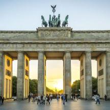a large monument with people walking in front of it