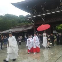 a group of people walking in front of a building