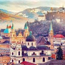 a view of a city with mountains in the background
