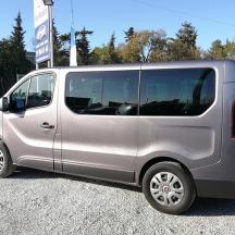a silver van parked in a parking lot