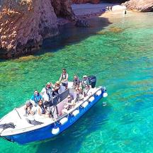 a group of people on a boat in the water