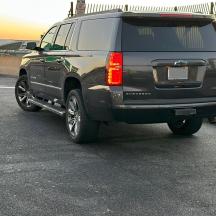 a black suv parked in a parking lot