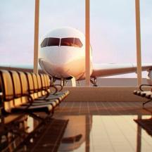 an airplane is parked in an airport terminal