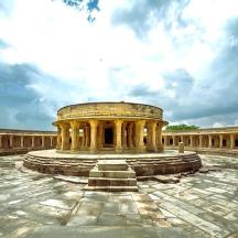 a large building with columns in a courtyard
