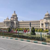 a large building with a fence in front of it